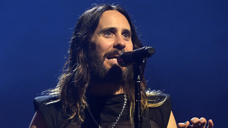 Jared Leto singing into microphone
