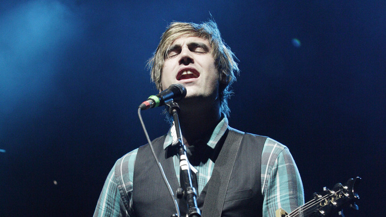 Charlie Simpson singing on stage in 2012