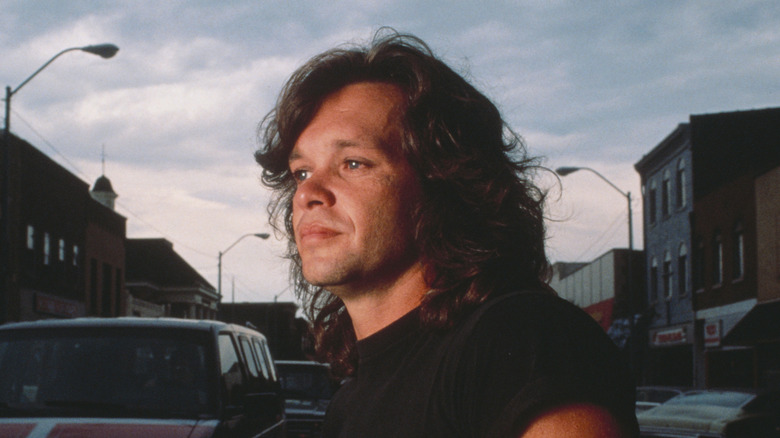 John Cougar Mellencamp looking out into the distance