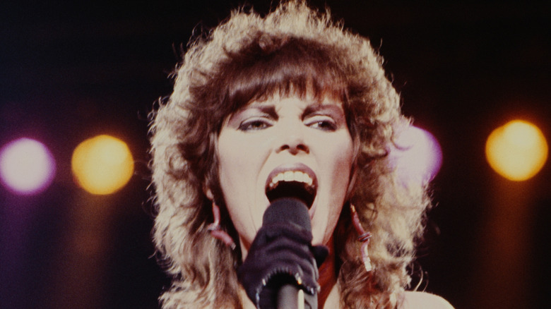 Front shot of Pat Benatar singing on stage