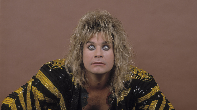 Ozzy Osbourne staring into the camera with a kimono on.