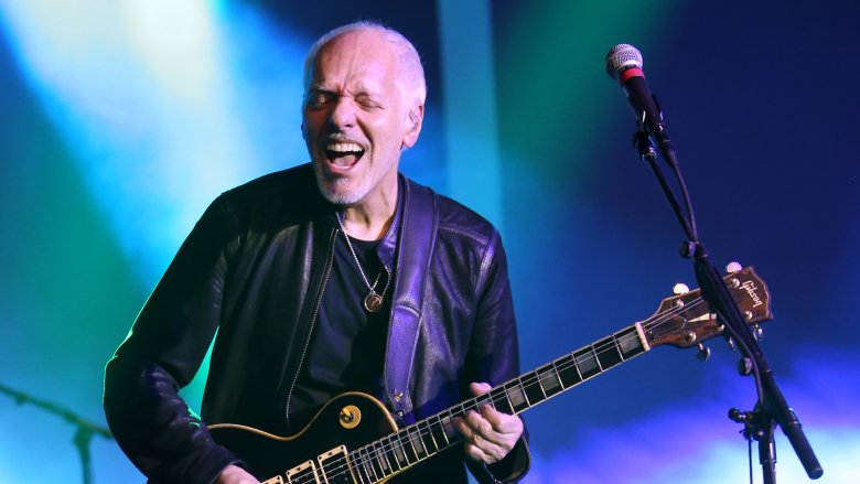 Peter Frampton playing guitar onstage