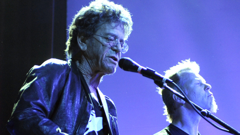 Lou Reed performing onstage next to James Hetfield of Metallica