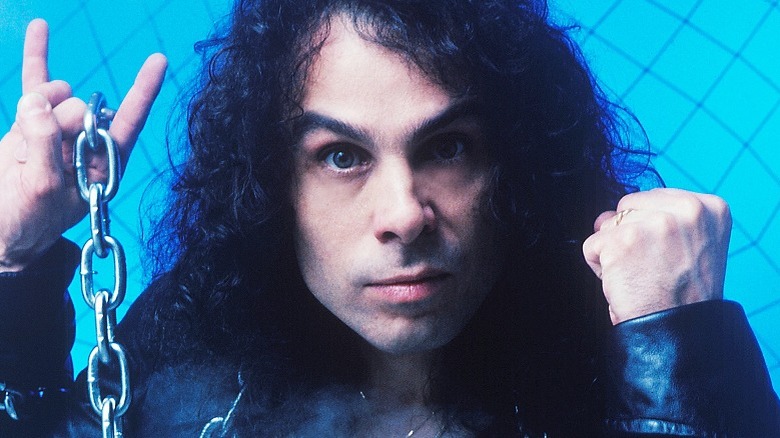 Ronnie James Dio portrait holding chains in 1983