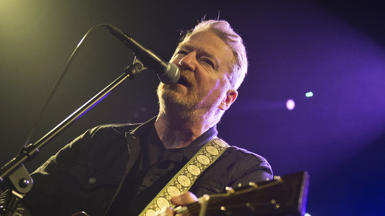 David Lowery singing and playing guitar onstage