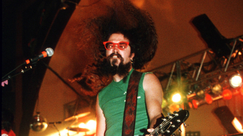 Jim Martin playing guitar onstage with Faith No More