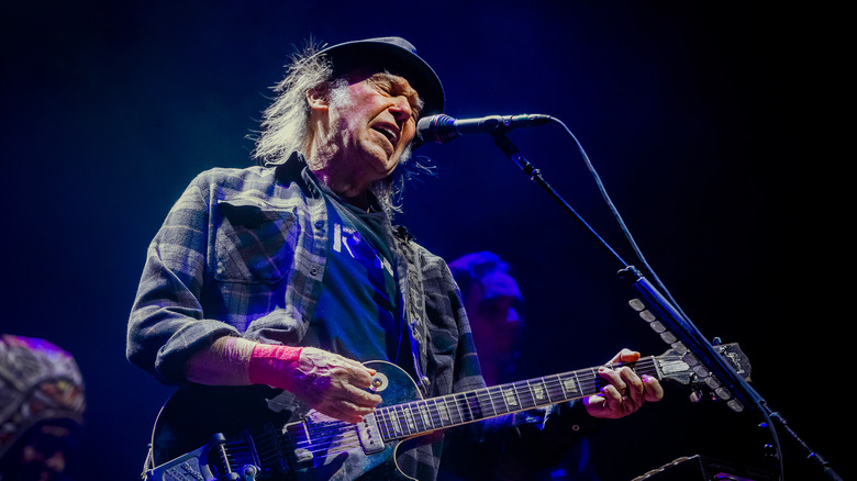Neil Young performing in concert