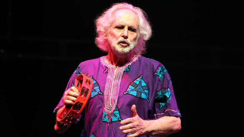 Pete Brown playing tambourine onstage