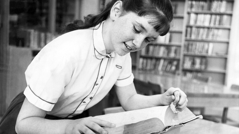 Girl consults dictionary