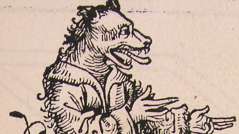 Woodcut of dog-headed man raising his arms