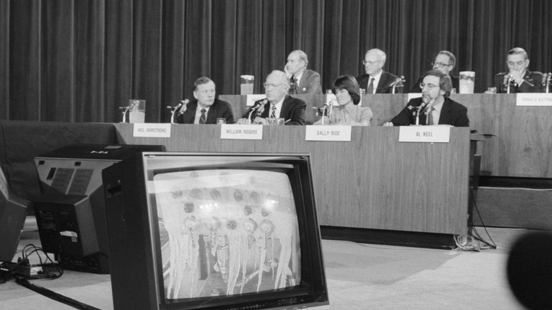 members of rogers commission watching footage