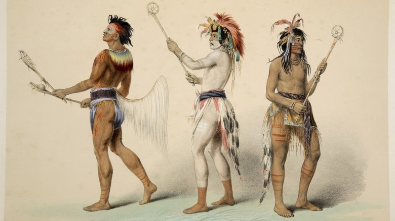 Native Americans holding dreamcatchers