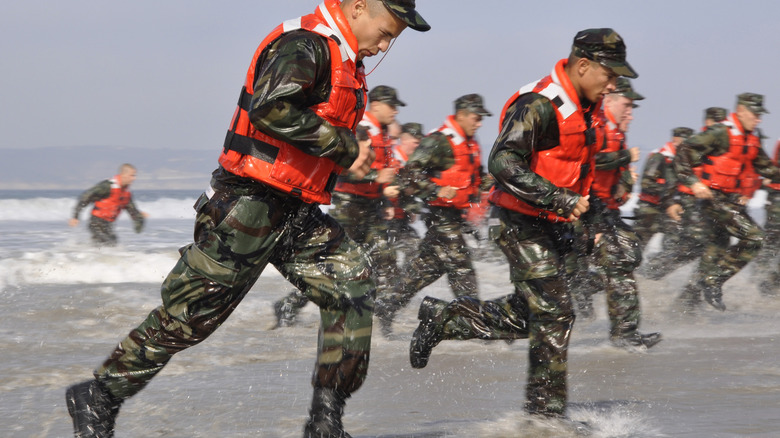 Soldiers running on the beach