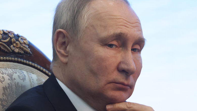 Vladimir Putin with finger on chin