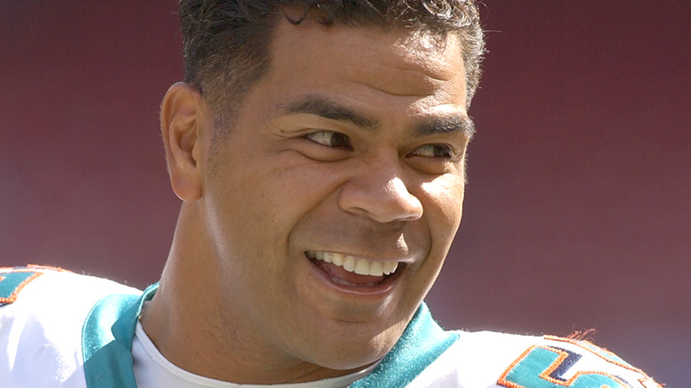 Junior Seau in Dolphins uniform, smiling