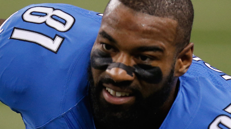 Calvin Johnson playing blue number 81 jersey