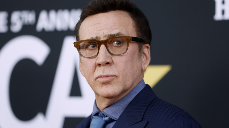 Nicolas Cage glasses looks to side