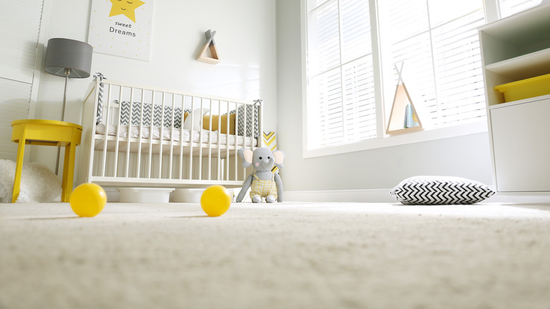 Empty crib in bedroom