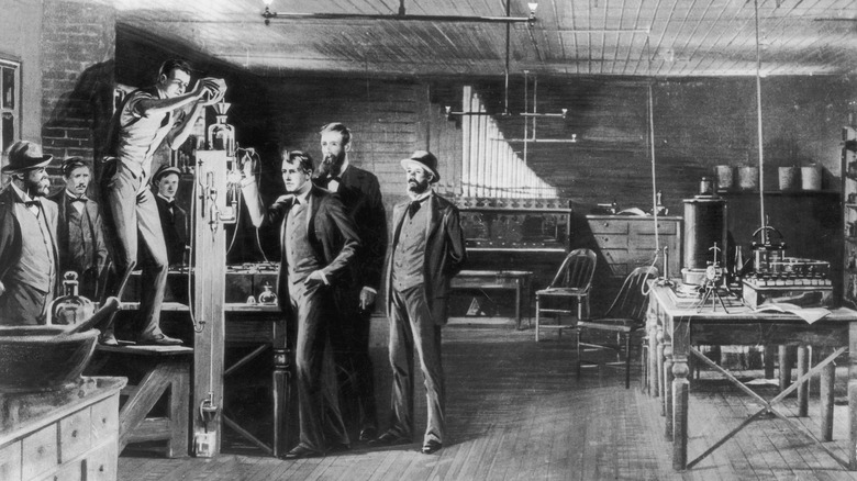 Scene depicting the first incandescent light being invented at Menlo Park in 1879