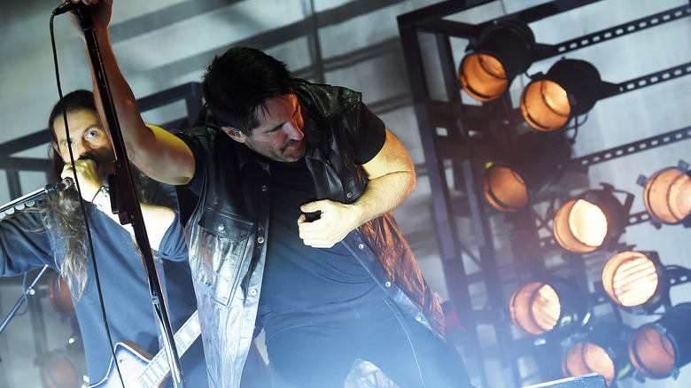 Reznor performing on stage