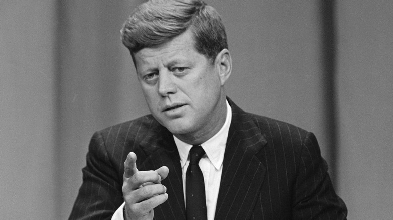 JFK points finger