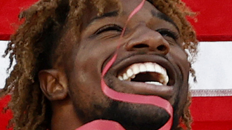 Noah Lyles celebrates