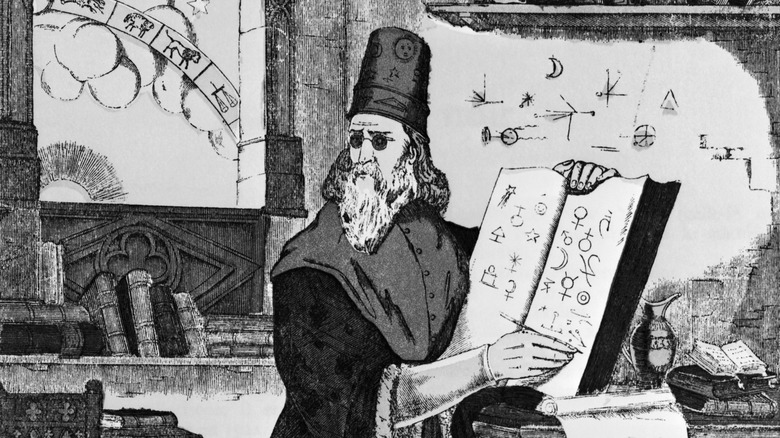 Engraving of Nostradamus writing in a book