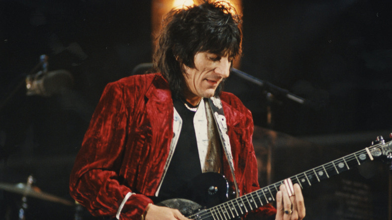 Ronnie Wood playing guitar onstage