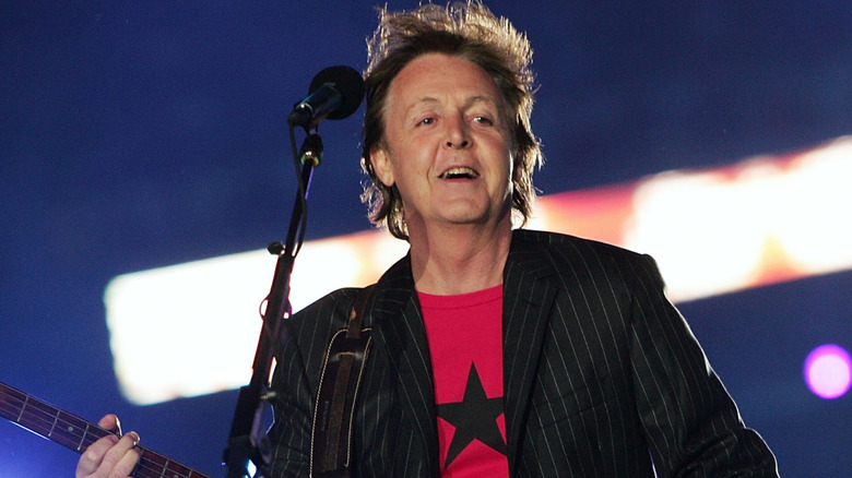 Paul McCartney smiling while performing at Super Bowl