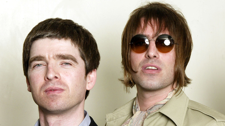 Noel and Liam Gallagher of Oasis staring ahead