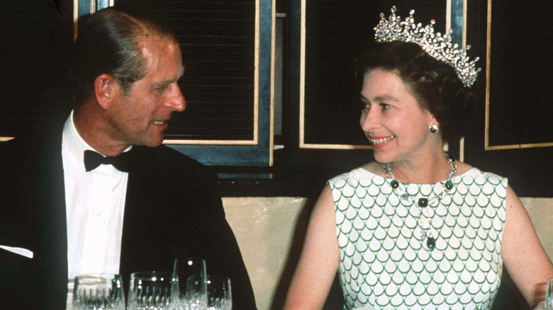 Prince Philip and Queen Elizabeth looking at each other