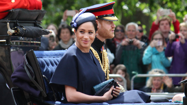 Meghan Markle and Prince Harry sitting in carriage