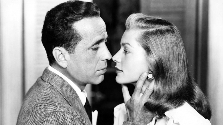 Humphrey Bogart and Lauren Bacall about to kiss