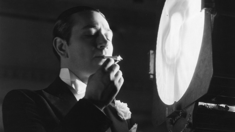 George Raft smoking cigarette