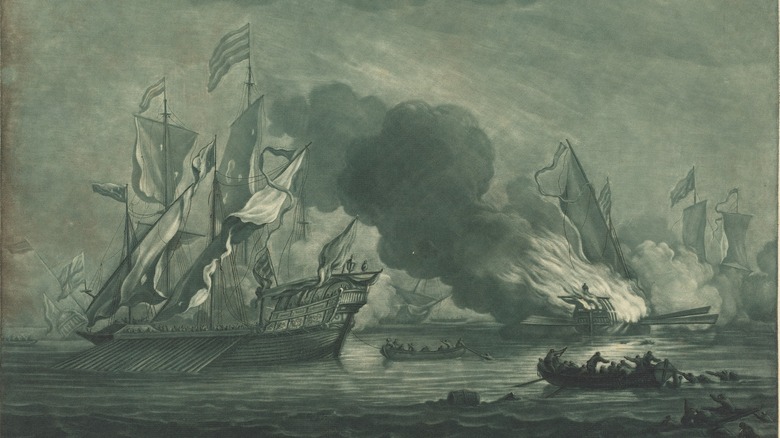 ship burning on ocean