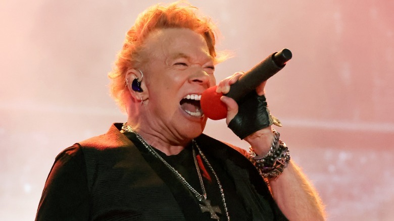 Axl Rose leather glove on stage singing