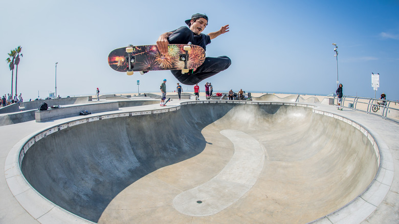 Skater pulling a trick at skate park