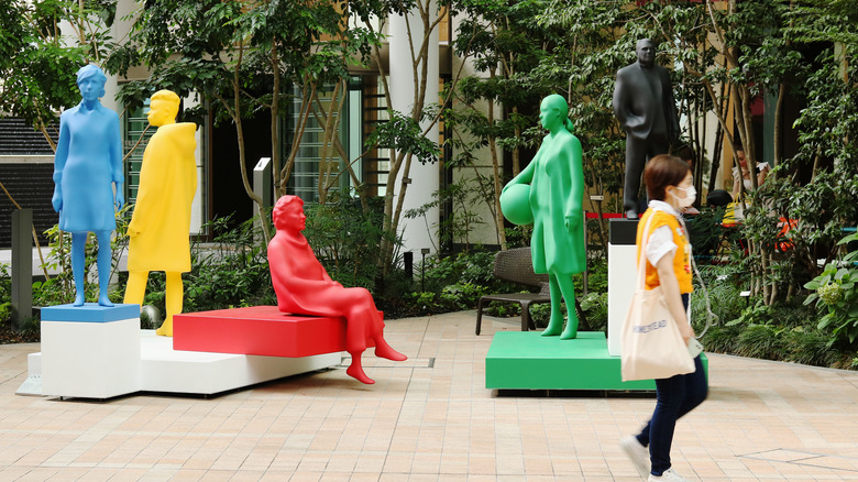 multicolored Olympic Agora statues on display