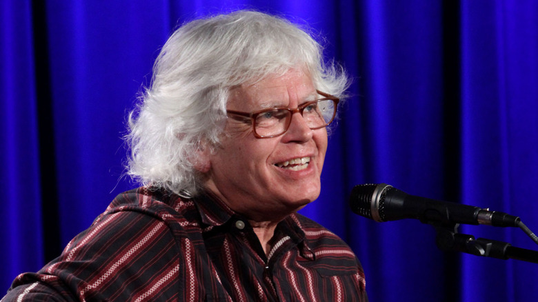 walter egan smiling on stage