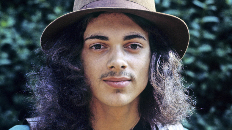 Andy Fraser of Free wearing hat and smiling into camera