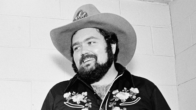 B.W. Stevenson in cowboy hat smiling and looking to the side