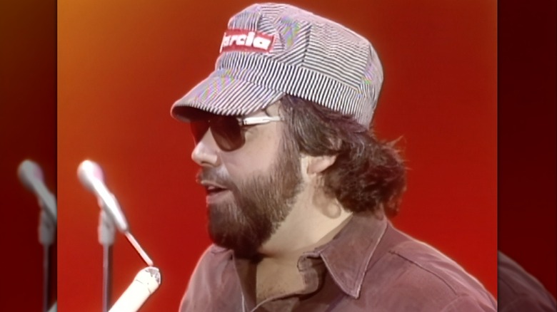 Gary Garcia in railroad hat being interviewed on red stage