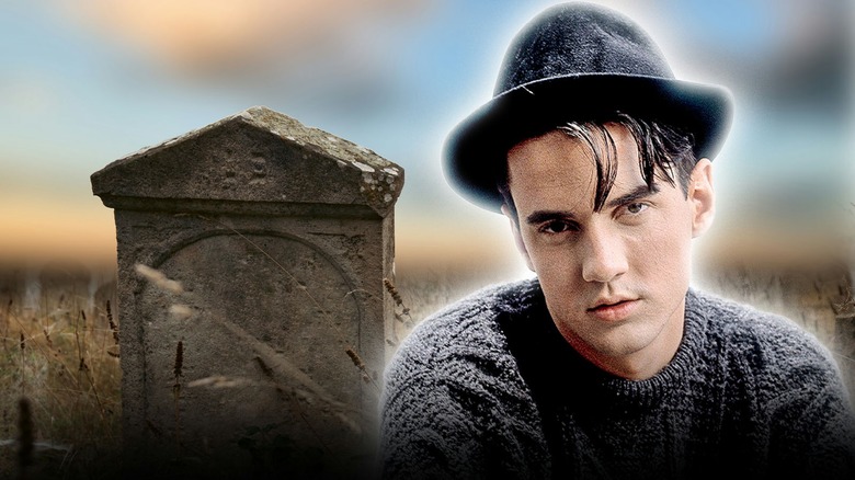 Tommy Page next to a gravestone