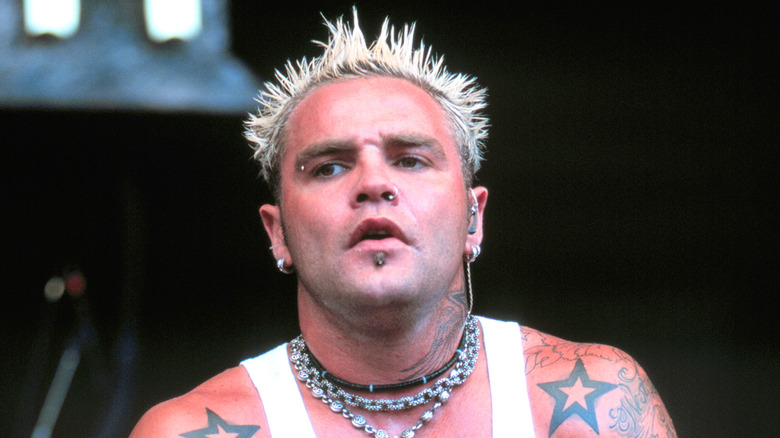 Shifty Shellshock of Crazy Town wincing on stage