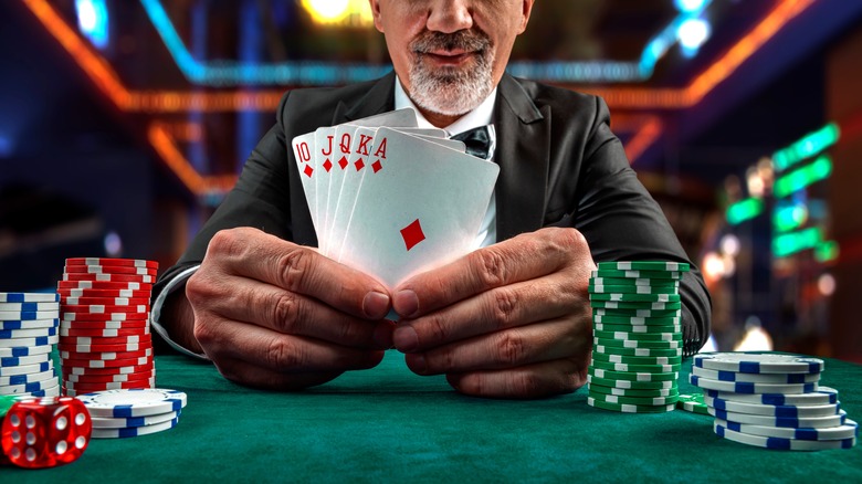 A poker hand and chips