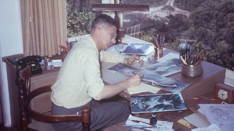 Dr. Seuss illustrating a book