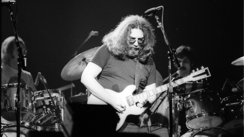 Jerry Garcia playing guitar onstage in 1980