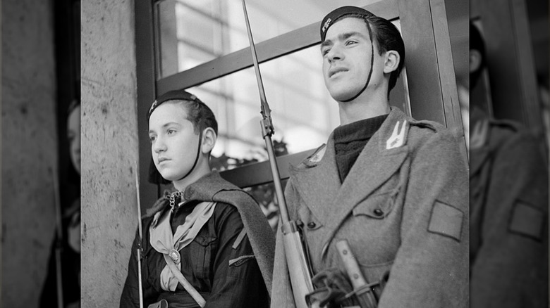 Two boys wearing Balilla uniforms standing at attention