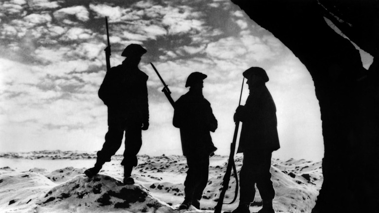 British soldiers holding guns