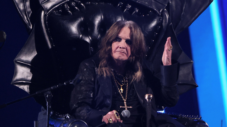 Ozzy Osbourne waving from throne